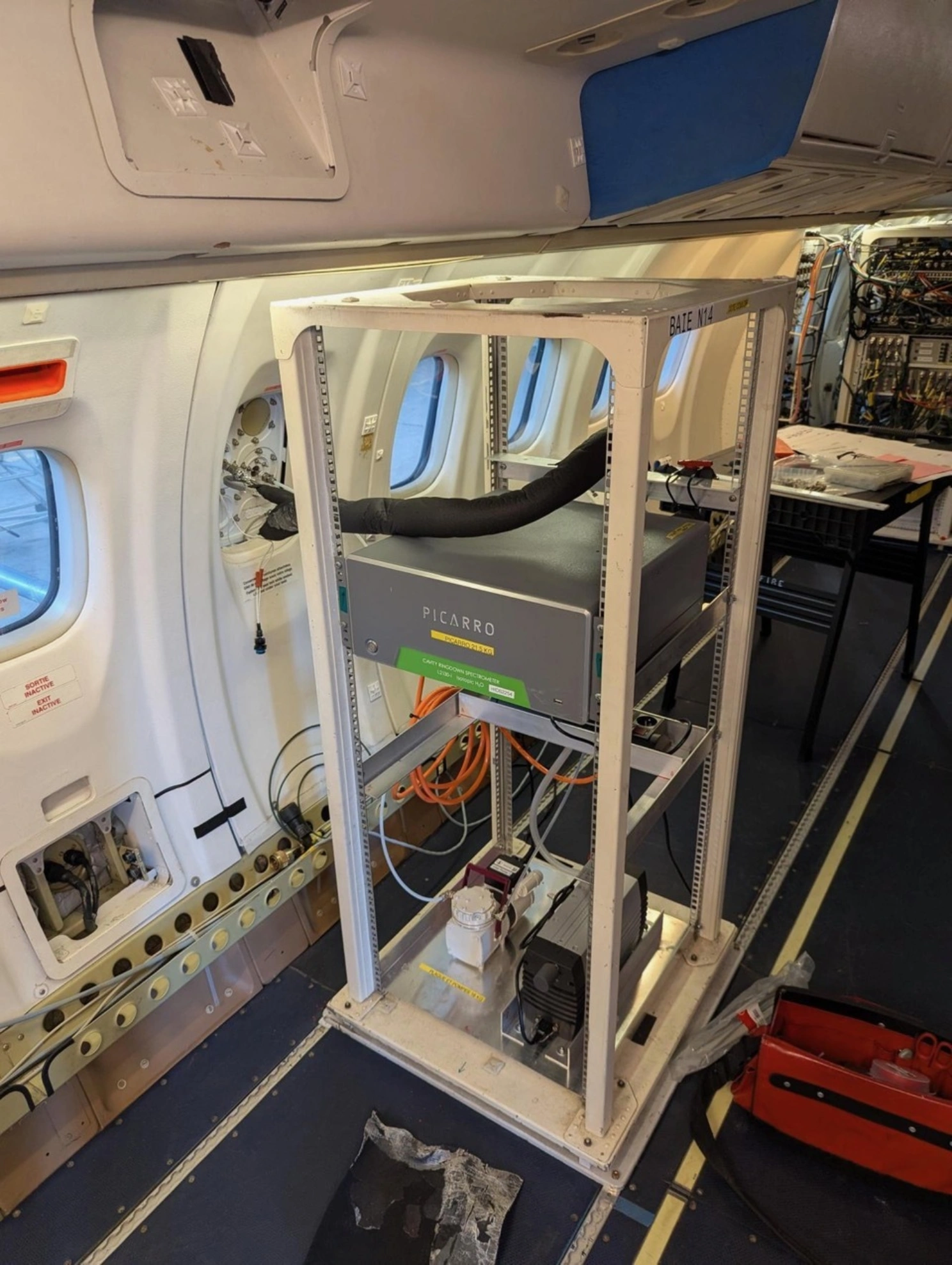 Isotope instrument from Picarro mounted in a rack in a research aircraft